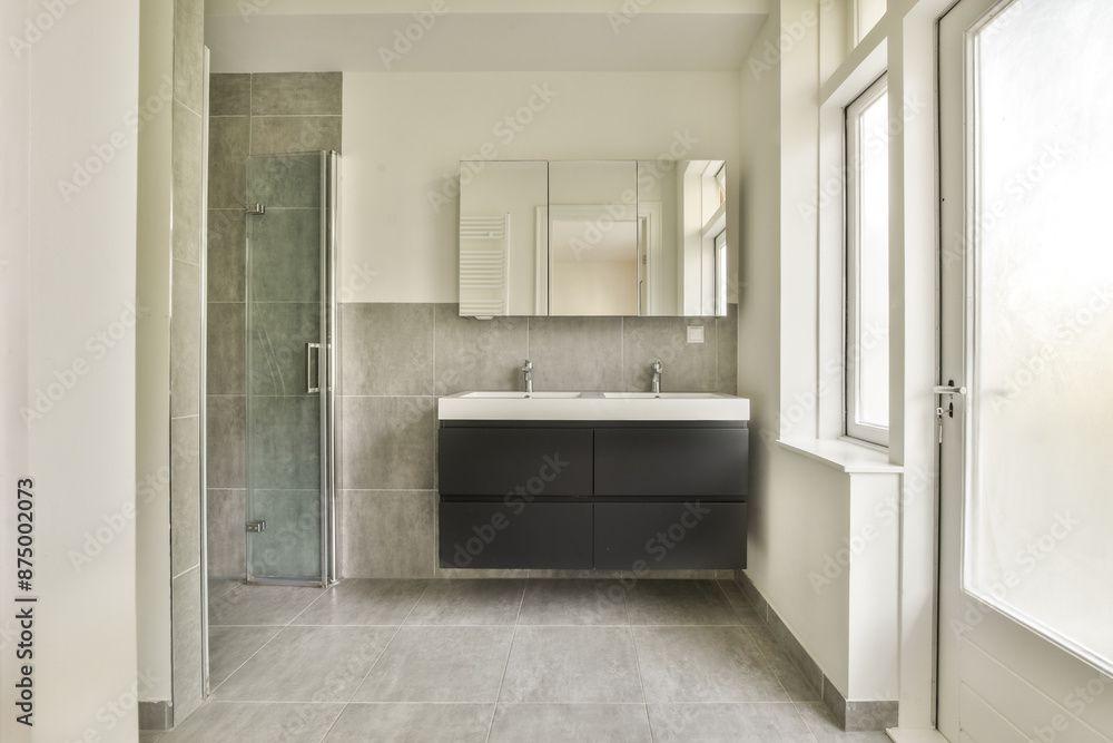Modern bathroom with sleek design and natural light Modern bathroom with sleek design and natural light
