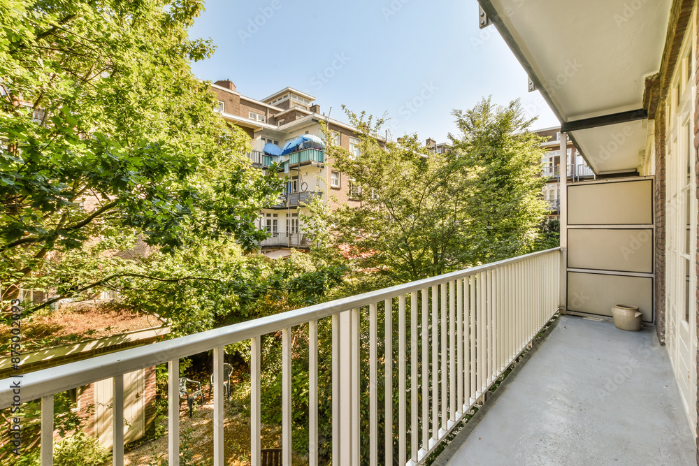 Spacious balcony with urban view and lush greenery Spacious balcony with urban view and lush greenery