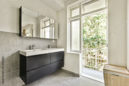 Modern Bathroom with Natural Light and Elegant Fixtures photo