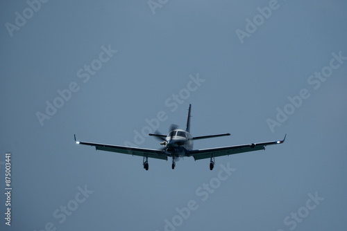 Foto Single-engined turboprop airplane in the cloudy sky.