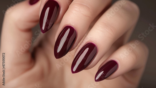 hand with Burgundy manicure close-up 