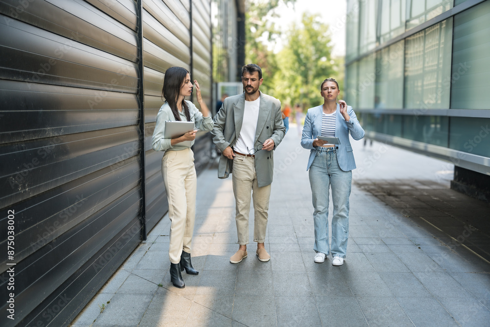 Fototapeta premium Young business people group businessman businesswoman walk from office building to building between meetings they train employees to better and more successful work in corporation and presentation