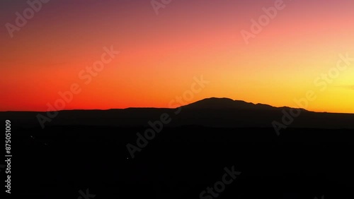 Wallpaper Mural Aerial Panning Shot Of Silhouette Tranquil Mountains Against Orange Sky During Sunset - Atacama Desert, Chile Torontodigital.ca