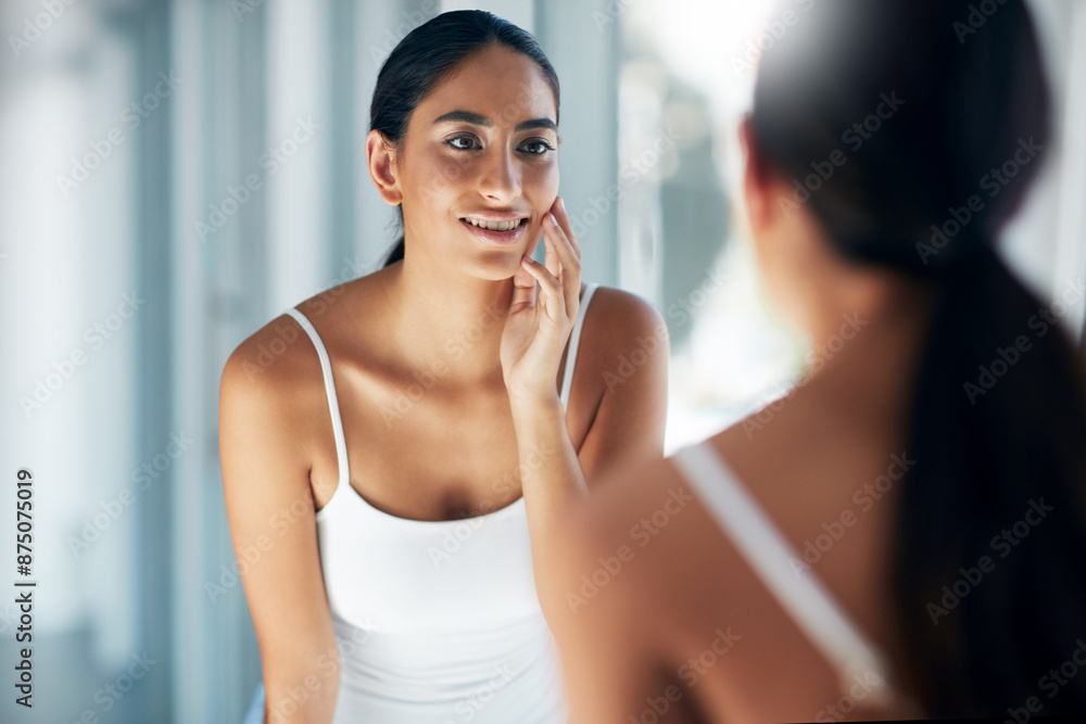 Woman, happy and touch in bathroom mirror for skincare, results and beauty or cosmetic breakout. Female person, reflection and skin in house for facial texture and dermatology after acne treatment