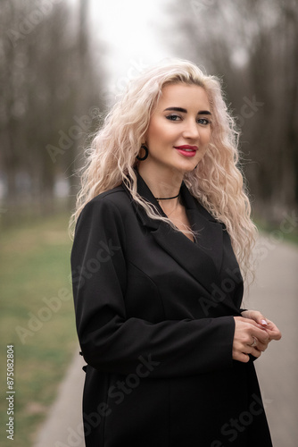 Portrait of a young beautiful blonde girl outdoors.