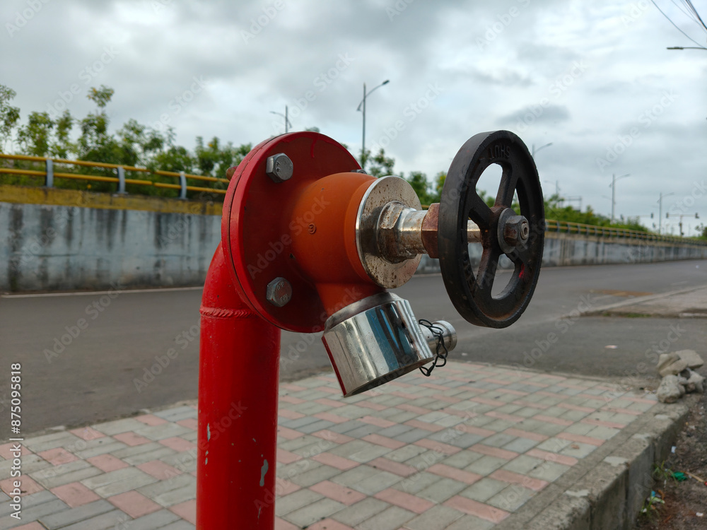 Fire hydrant outlet valve fire safety closeup safety box, folded pipe fire precautions safety measure emergency service Fire hydrant outlet valve fire safety closeup safety box, folded pipe fire precautions safety measure emergency service