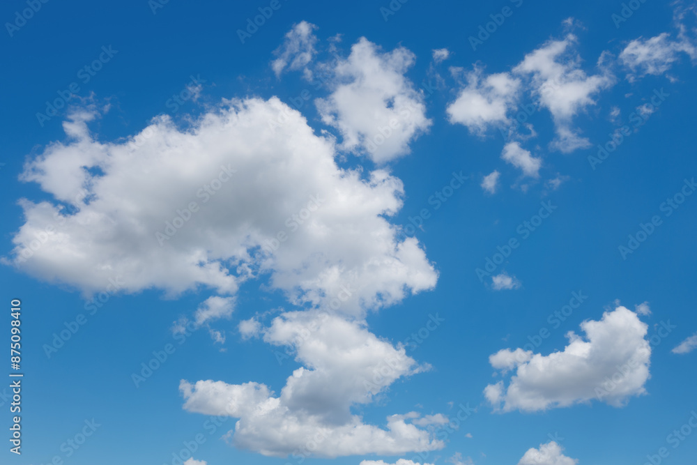abstract background of white fluffy clouds on a bright blue sky abstract background of white fluffy clouds on a bright blue sky