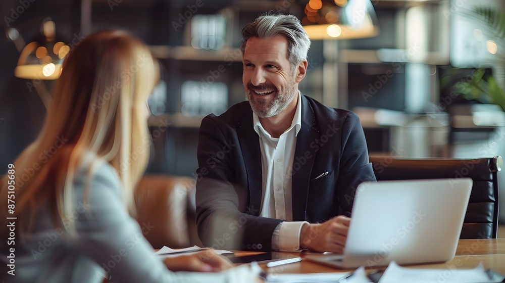 Senior Businessman Meeting with Financial Advisor Discussing Income Strategies in Cozy Office Senior Businessman Meeting with Financial Advisor Discussing Income Strategies in Cozy Office