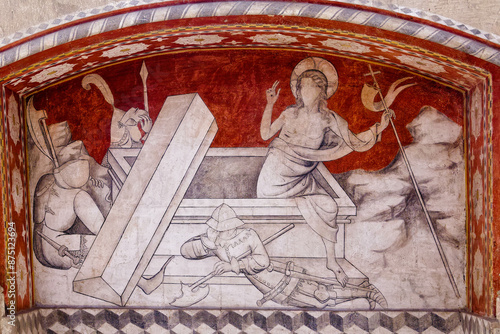 Ancient wall fresco depicting Jesus rising from the dead out of the tomb. Fresque murale ancienne représentant Jesus sortant ressuscité des morts sortant du tombeau. photo