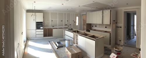 Transformation in Progress - Modern Kitchen Mid-Renovation with New Appliances Installation and Cabinet Fitting
