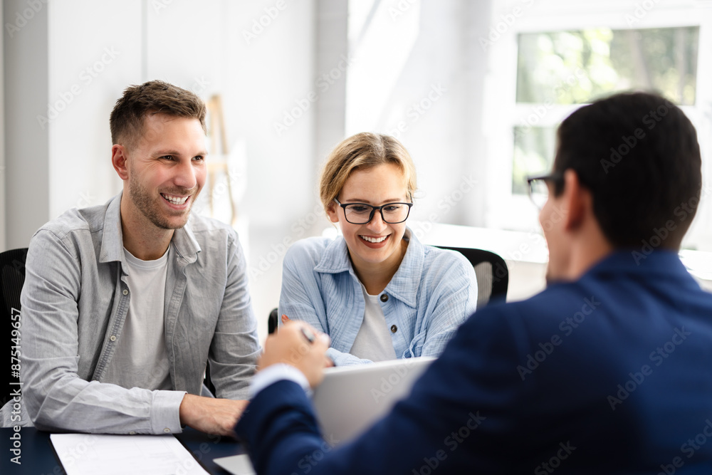 young couple is meeting with a financial planner young couple is meeting with a financial planner