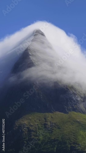 Top of mountain hike summit overlooking epic Lofoten Archipelago landscape. Inspiring and amazing idea of adventure. 