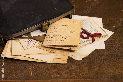 Postal letters in the vintage black handbag