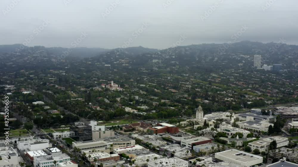 Aerial Panning Beautiful Shot Of Houses In Residential City By Hills Against Clear Sky - Beverly Hills, California Aerial Panning Beautiful Shot Of Houses In Residential City By Hills Against Clear Sky - Beverly Hills, California