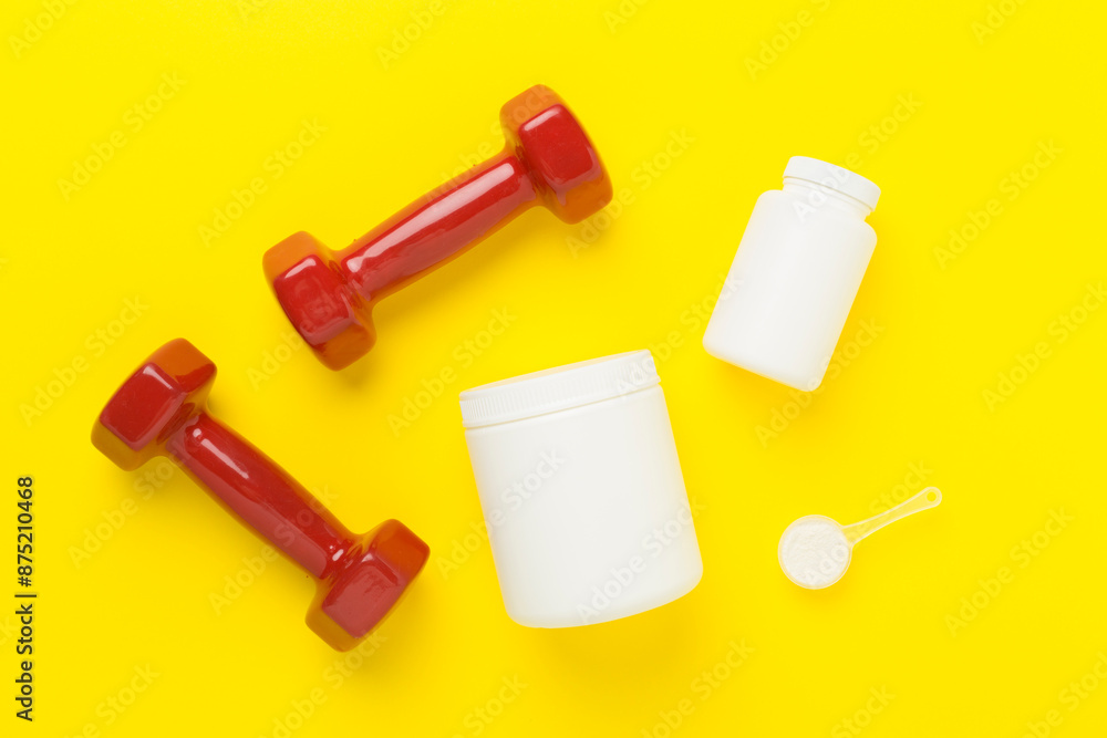 Fototapeta premium Jars with protein powder on color background, top view. Sports nutrition concept