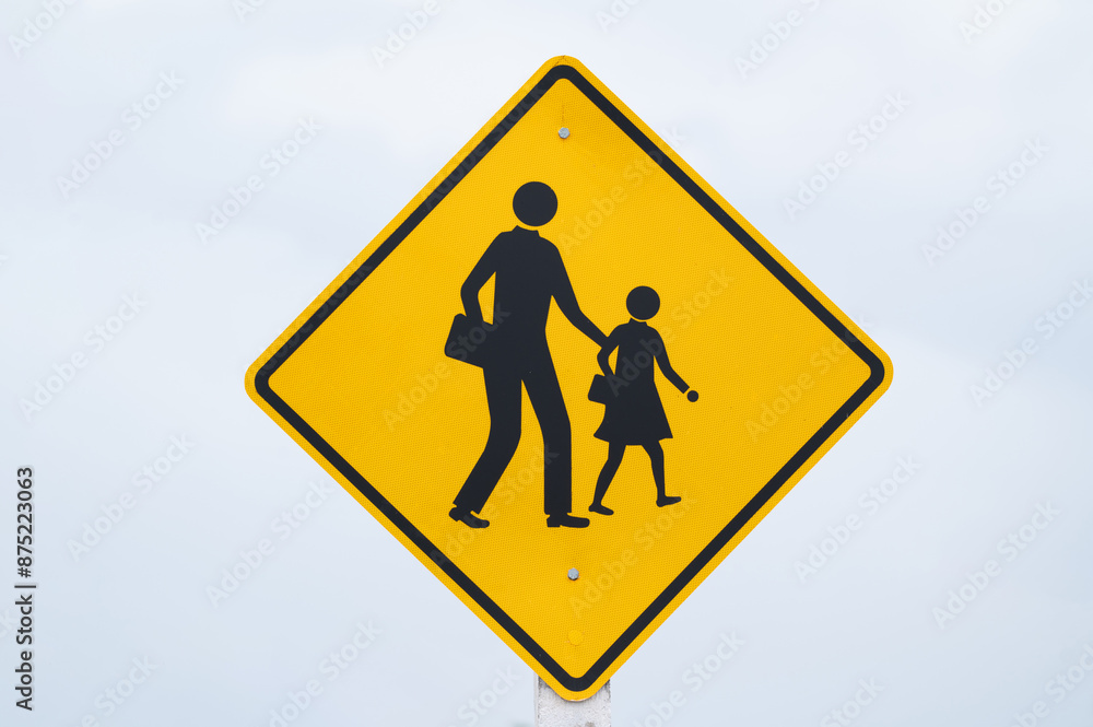 school zone sign is on light blue sky. school zone sign is on light blue sky.