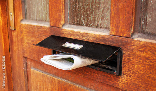 Newspaper in Wooden Door Mailbox, Close-up, News Newspaper Mail Delivery