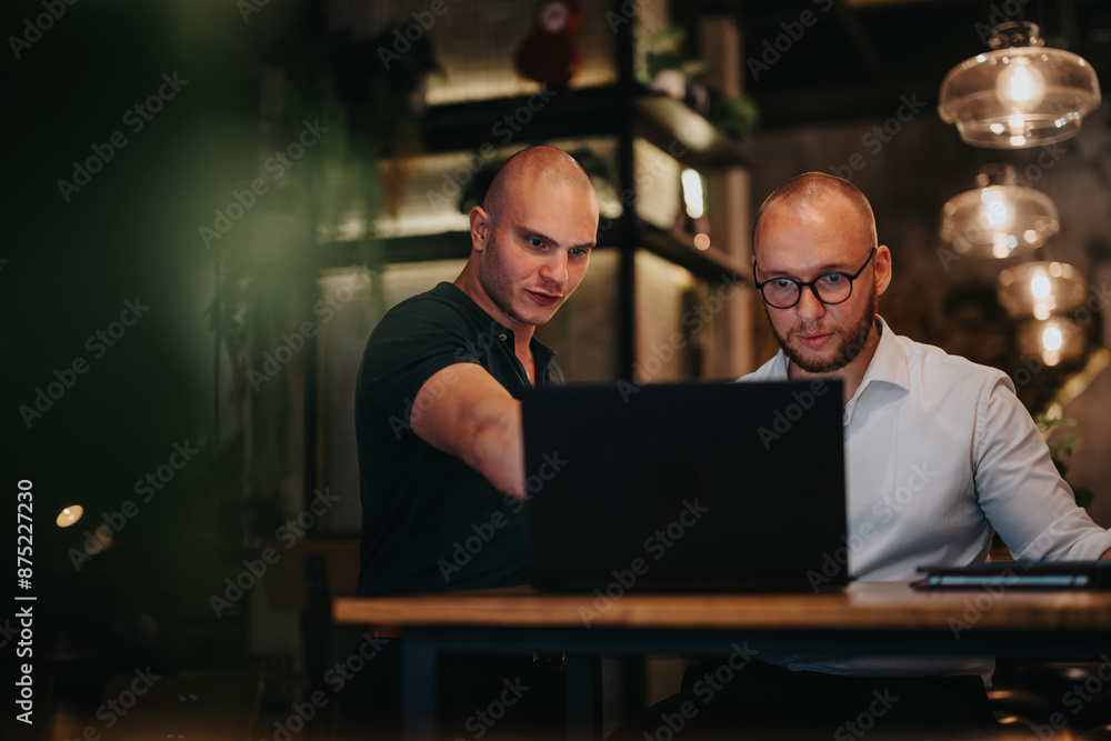Two businessmen discussing strategy and analysis during a collaborative meeting indoors, focusing on teamwork and growth. Two businessmen discussing strategy and analysis during a collaborative meeting indoors, focusing on teamwork and growth.