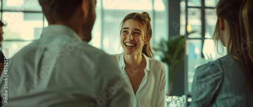 Female business leader leading a team meeting in a boardroom.