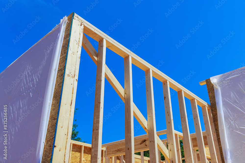Frame for support beam unfinished interior timber during construction of new home Frame for support beam unfinished interior timber during construction of new home