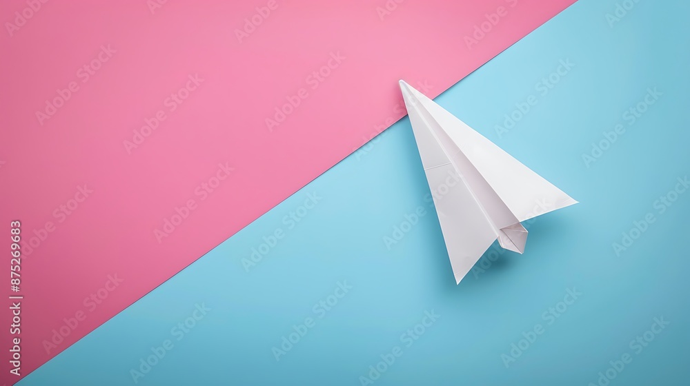 White paper plane is flying to the right isolated on pink and blue background White paper plane is flying to the right isolated on pink and blue background