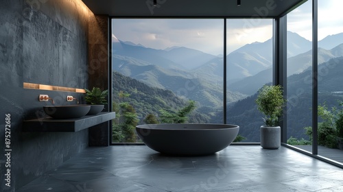 Minimalist bathroom with a dark bathtub and sink against a dark wall, light-filled room with large windows overlooking mountains © Budi