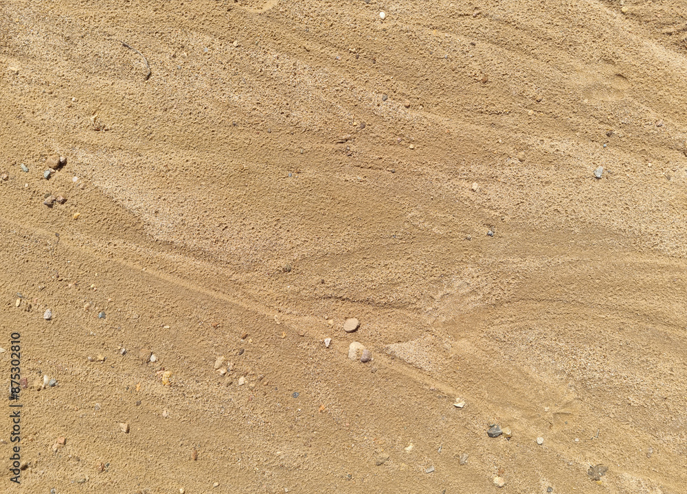 Sand on the beach as an abstract background. Sand deposits after water flow. Texture. Pattern. Selective focus Sand on the beach as an abstract background. Sand deposits after water flow. Texture. Pattern. Selective focus