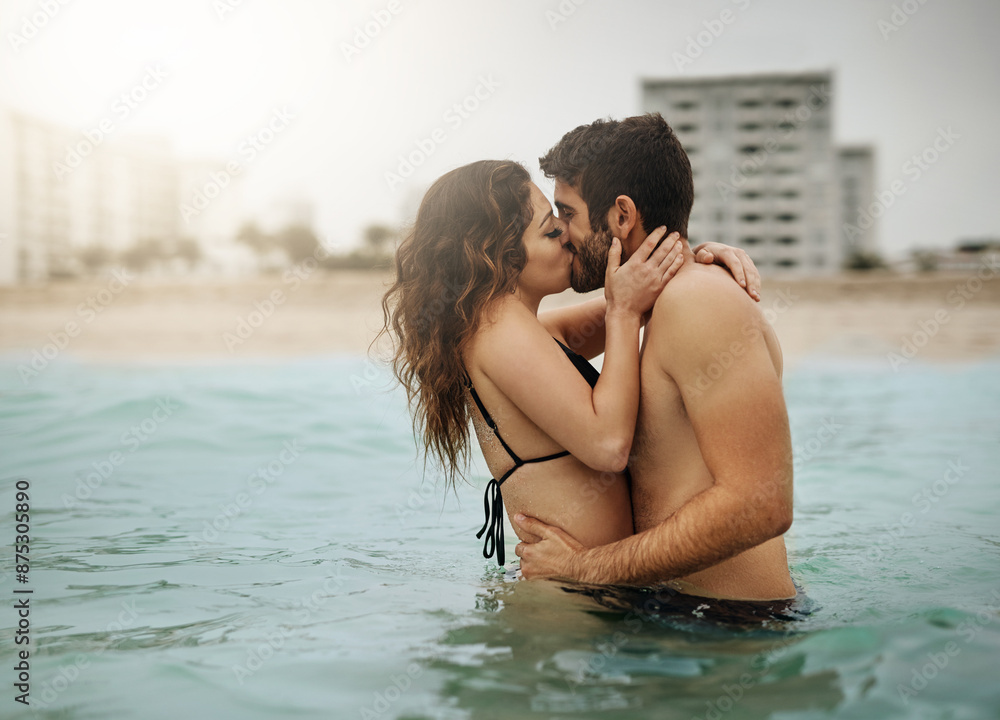 Fototapeta premium Water, romance or couple kiss at sea to travel for love on vacation, valentines day or outdoor holiday. Swimming, hug and people at beach for bonding together for romantic trip on tropical island