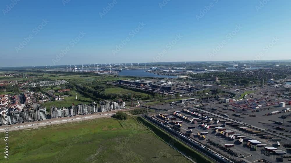 Aerial View of Zeebrugge Cargo Port With Wind Turbines in the Distance Aerial View of Zeebrugge Cargo Port With Wind Turbines in the Distance