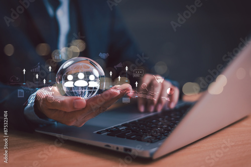 CRM, customer relationship management concept. Businessman, headhunter hold global network to recruit human icon with computer laptop. HR, customer focus target group. Digital marketing online