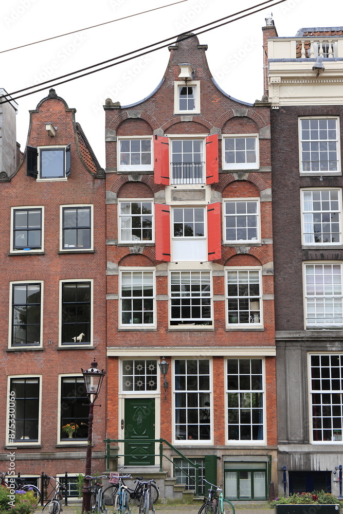 Obraz premium Amsterdam Brouwersgracht Canal House Facade with Red Wooden Shutters, Netherlands
