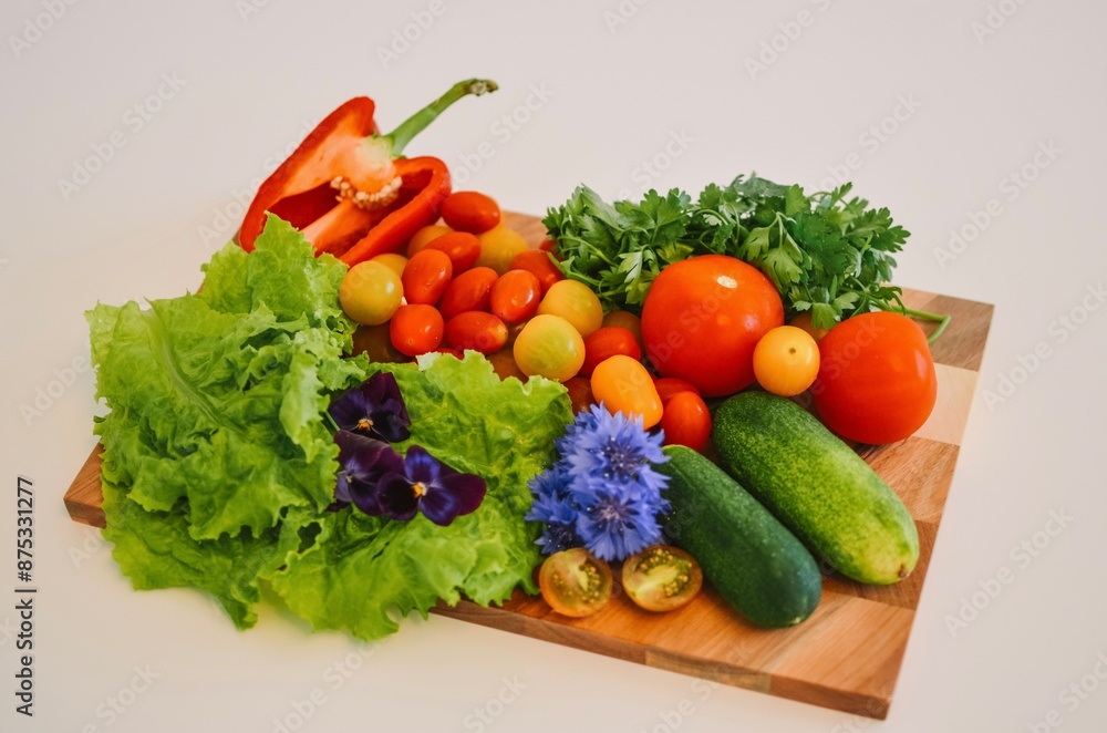 wooden board with vegetables like tomatoes, cucumbers, paprika and herbs on a white background wooden board with vegetables like tomatoes, cucumbers, paprika and herbs on a white background