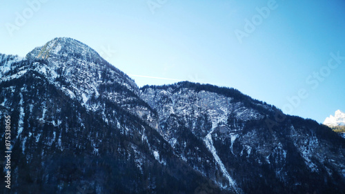 Mountains in the snow. Snow covered mountains. Landscape in the mountains with blue sky. Beautiful nature view 