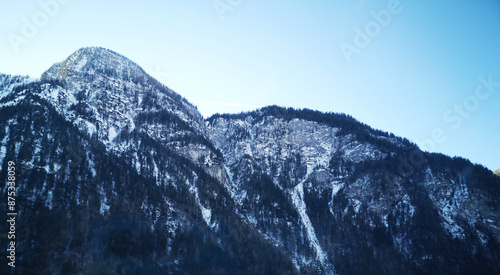 Mountains in the snow. Snow covered mountains. Landscape in the mountains with blue sky. Beautiful nature view 
