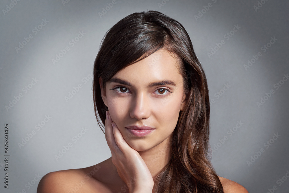 Portrait, skincare and woman touch face for glow, shine and natural isolated on gray studio background. Beauty, makeup and confident model in cosmetics at spa for dermatology, wellness and aesthetic Portrait, skincare and woman touch face for glow, shine and natural isolated on gray studio background. Beauty, makeup and confident model in cosmetics at spa for dermatology, wellness and aesthetic