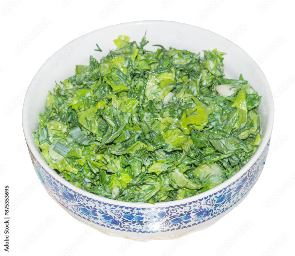 Vegetarian dish of green lettuce leaves in a plate on white. In a vegetarian restaurant. Vegetarian dish of green lettuce leaves in a plate on white. In a vegetarian restaurant.