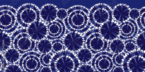 Vector blue shibori circle wheels overlap horizontal border pattern. With spiderweb detail. Suitable for invitation cards and posters.