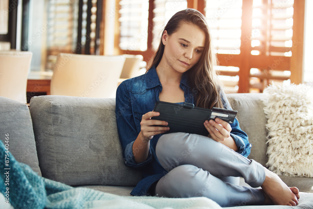 Home, tablet and card of woman, reading and smile for info of credit score, sofa and digital in house. Check, online banking and affordability results in app and personal loan and research on couch Home, tablet and card of woman, reading and smile for info of credit score, sofa and digital in house. Check, online banking and affordability results in app and personal loan and research on couch
