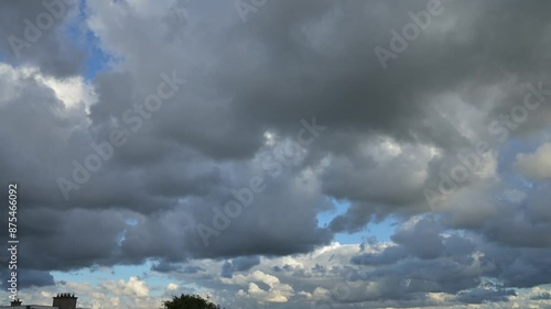 Timelapses of a blue sky hidden by heavy clouds, cloud scape over the horizon the city