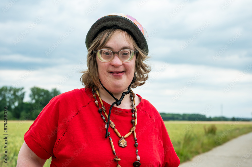 Outdoor portrait of a 41 yo girl with the Down Syndrome at the Flemish countryside around Tienen, Belgium Outdoor portrait of a 41 yo girl with the Down Syndrome at the Flemish countryside around Tienen, Belgium
