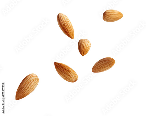 Almonds scattered on a black background.
