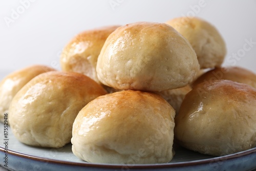 Delicious dough balls on plate, closeup view