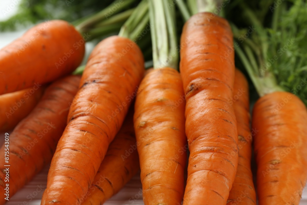Tasty ripe juicy carrots on table, closeup Tasty ripe juicy carrots on table, closeup