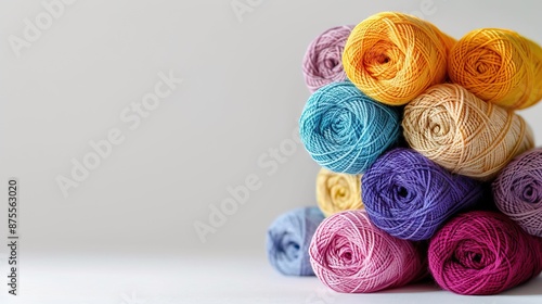 Colorful knitting yarn set on light background with copy space.