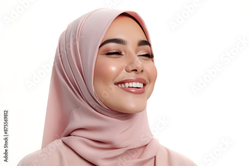 Smiling happy arab muslim woman in pink hijab clothes broadlyexpresses positive emotions, looking to side. isolated on white background. Portrait