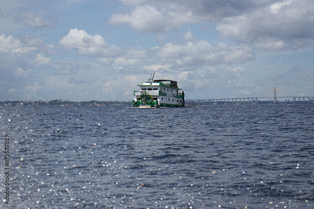 passenger boat sailing over Rio Negro in the Amazon passenger boat sailing over Rio Negro in the Amazon