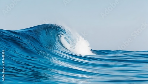 Blue ocean wave with white splashes close-up.