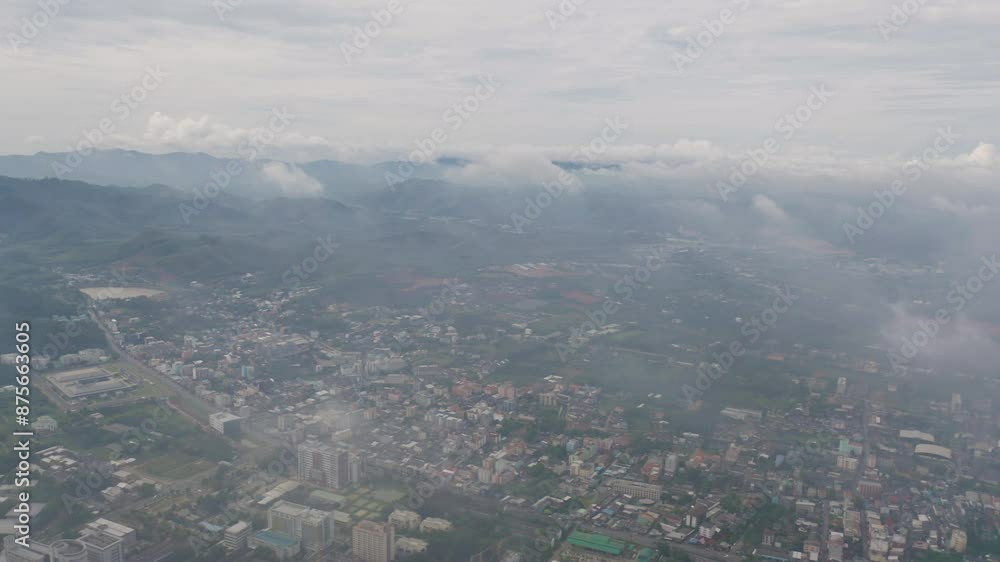 Aerial view of residential neighborhood roofs with fog mist in rainy season. Urban housing development from above. Top view. Real estate in Phuket, southern province city, Thailand. Aerial view of residential neighborhood roofs with fog mist in rainy season. Urban housing development from above. Top view. Real estate in Phuket, southern province city, Thailand.