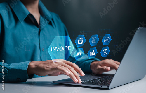 Invoice and online digital statements concept. Businessman using laptop to manage documents for invoice online. photo