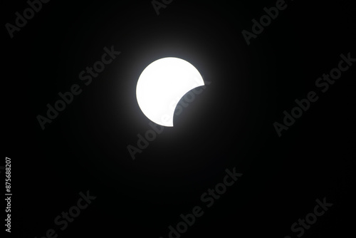 Total eclipse waxing as moon begins to cover the sun